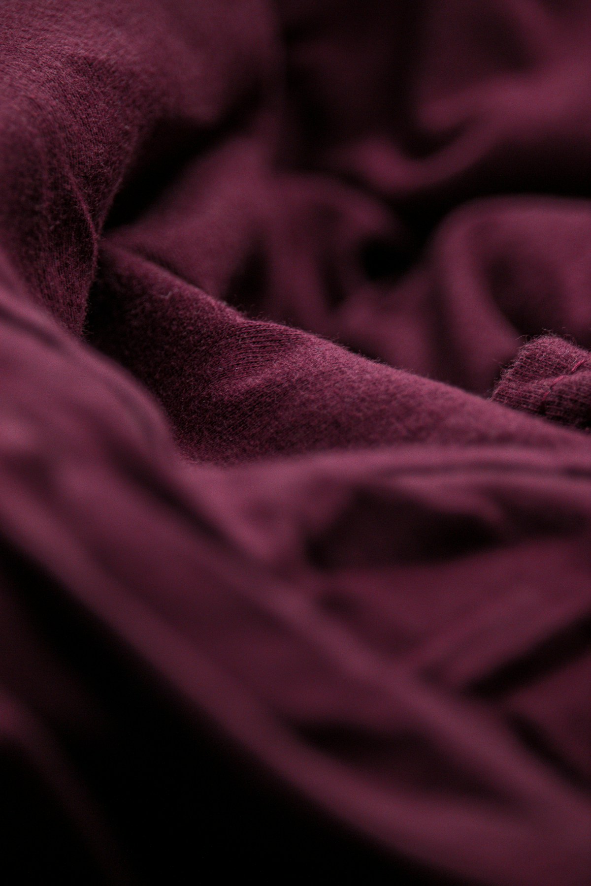 Close-up of folded premium clothing in a wholesale setting